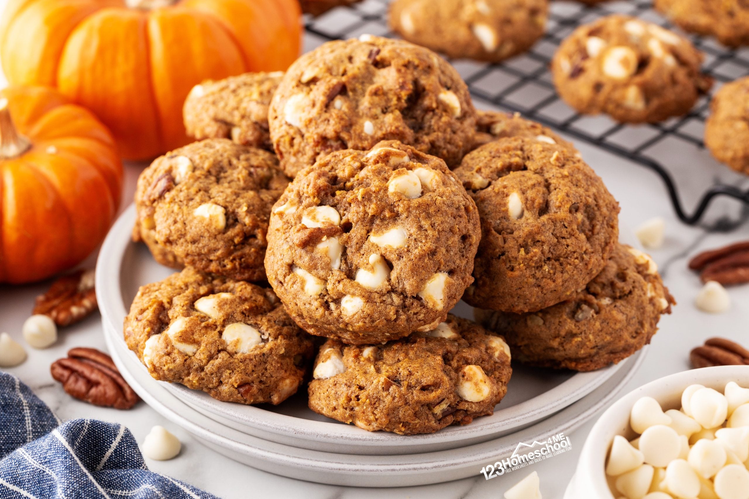 Indulge in the deliciousness of pumpkin white chocolate chip cookies made with healthy pumpkin, oats, pecans, and a blend of spices for a truly decadent treat!
