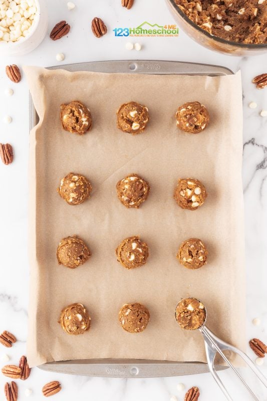 Pumpkin white chip cookies Start by lining your cookie sheets with parchment paper for easy clean-up. Using a cookie scoop, plop your dough onto the prepared sheets. Bake them for about 11 minutes or until they turn a lovely golden brown.