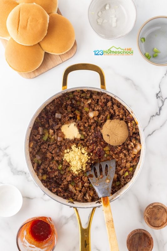 add seasoning Start by adding 2 tablespoons of brown sugar, 2 teaspoons of ground mustard, and 1 teaspoon of garlic powder. Let it simmer for at least 15 minutes to meld those delicious flavors together.