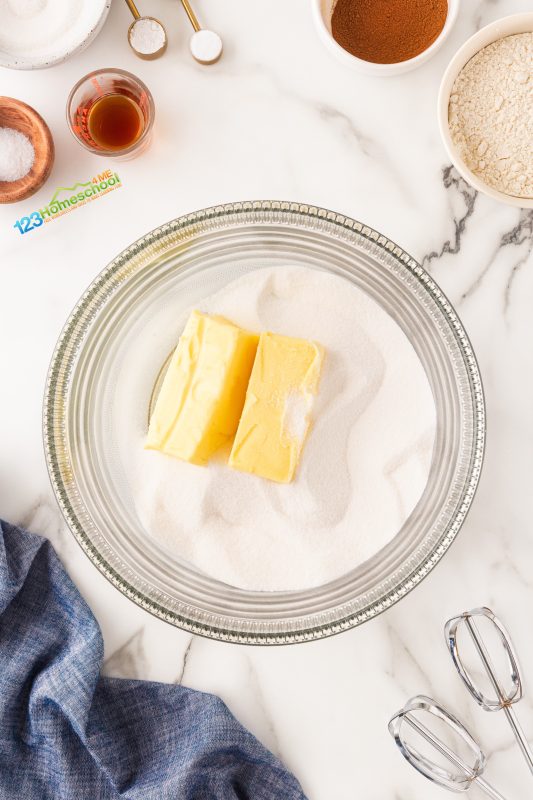 Let’s get baking! Start by preheating your oven to 350°F.

In a large mixing bowl, beat together butter and sugar for 4-5 minutes until the mixture is light and fluffy.