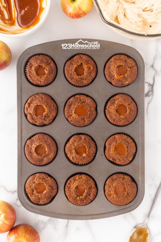 Time to add a delicious twist to your apple spice cupcakes! Using a spoon or melon baller, gently scoop out a small section from the center of each cupcake. Then, drizzle in a generous spoonful of rich, cooled caramel sauce right into the hollow. caramel filling for apple spice cupcakes