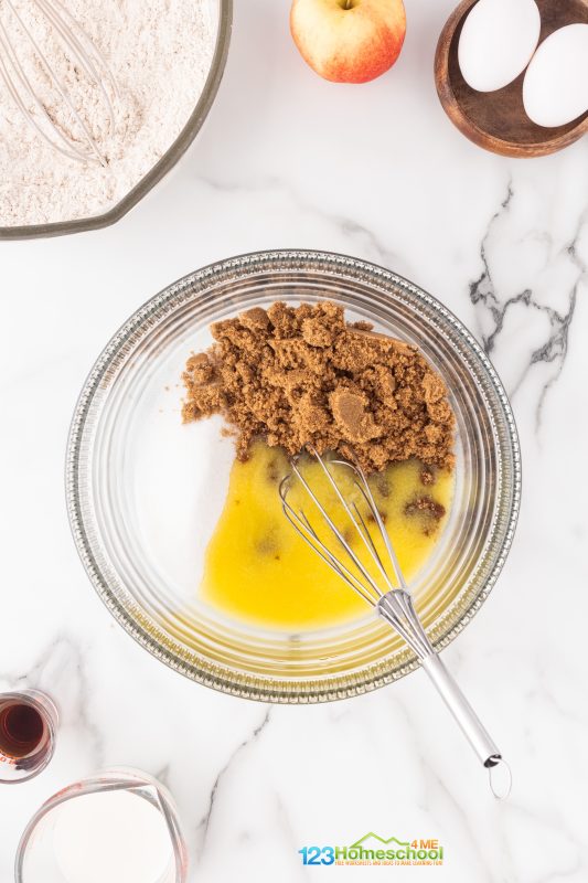 combine sugar and butter In a medium bowl, mix together the melted butter, brown sugar, and granulated sugar until well combined.
