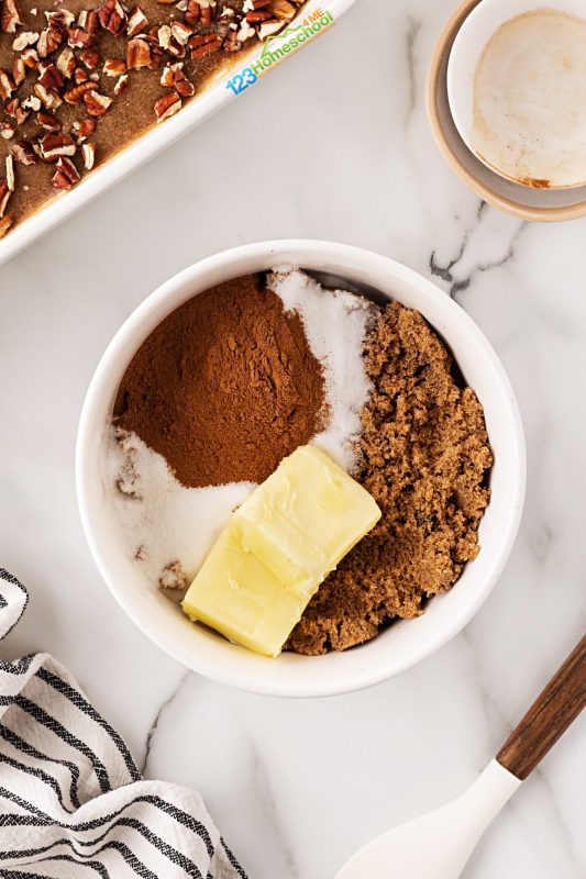 combine butter cinnamon and brown sugar to make filling Next, mix together your filling ingredients and spread them evenly over the dough. Since the filling can be a bit crumbly, I like to gently press it down to help it stick.