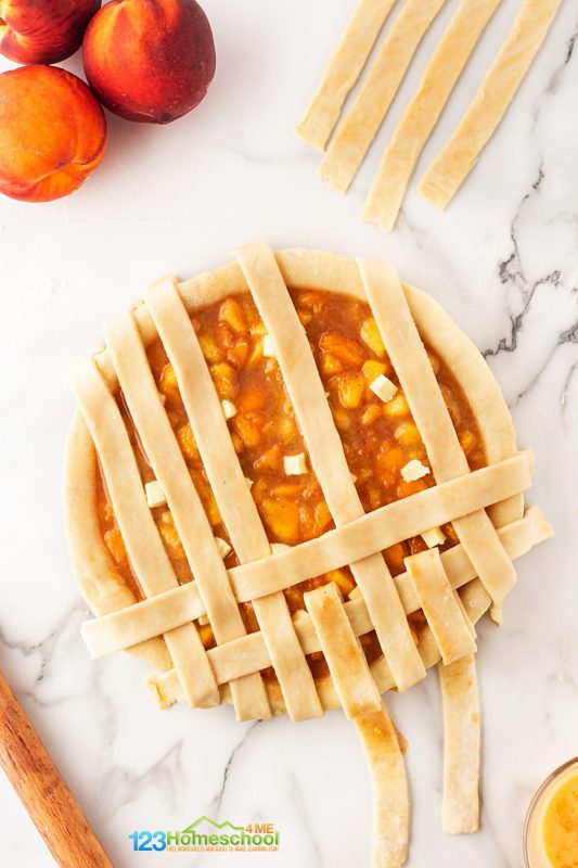 lifting every other strip put pie crust horizontal to make lattice top Next, take another strip and lay it perpendicular to the folded strips, then unfold them back over this strip. Repeat the process, alternating folding every other strip, until the entire pie is covered with a beautiful lattice pattern!