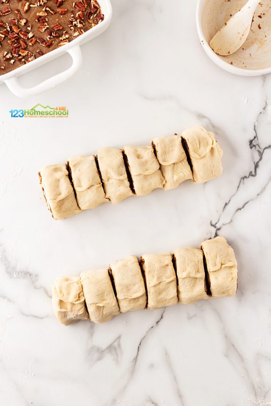 slice into 12 rolls Using a serrated knife, slice the log into 12 even pieces and arrange them atop the prepared topping in your baking dish.