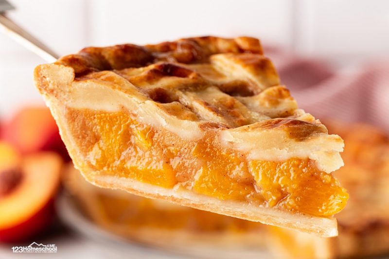 slice of homemade peach pie This bonus step helps ensure a deliciously firm filling when you slice into it.